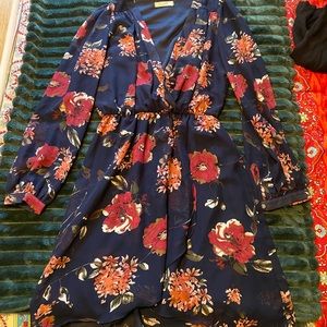 Honey Belle. Deep v-neck, buttoned sleeve cuffs.